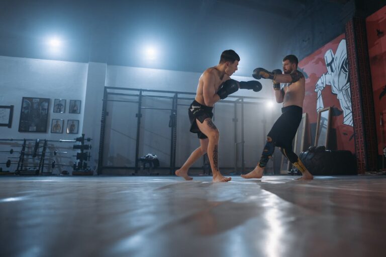 Two fighters sparring in MMA gym
