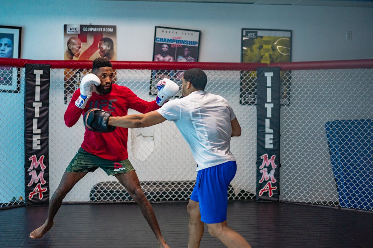MMA fighters training in indoor gym