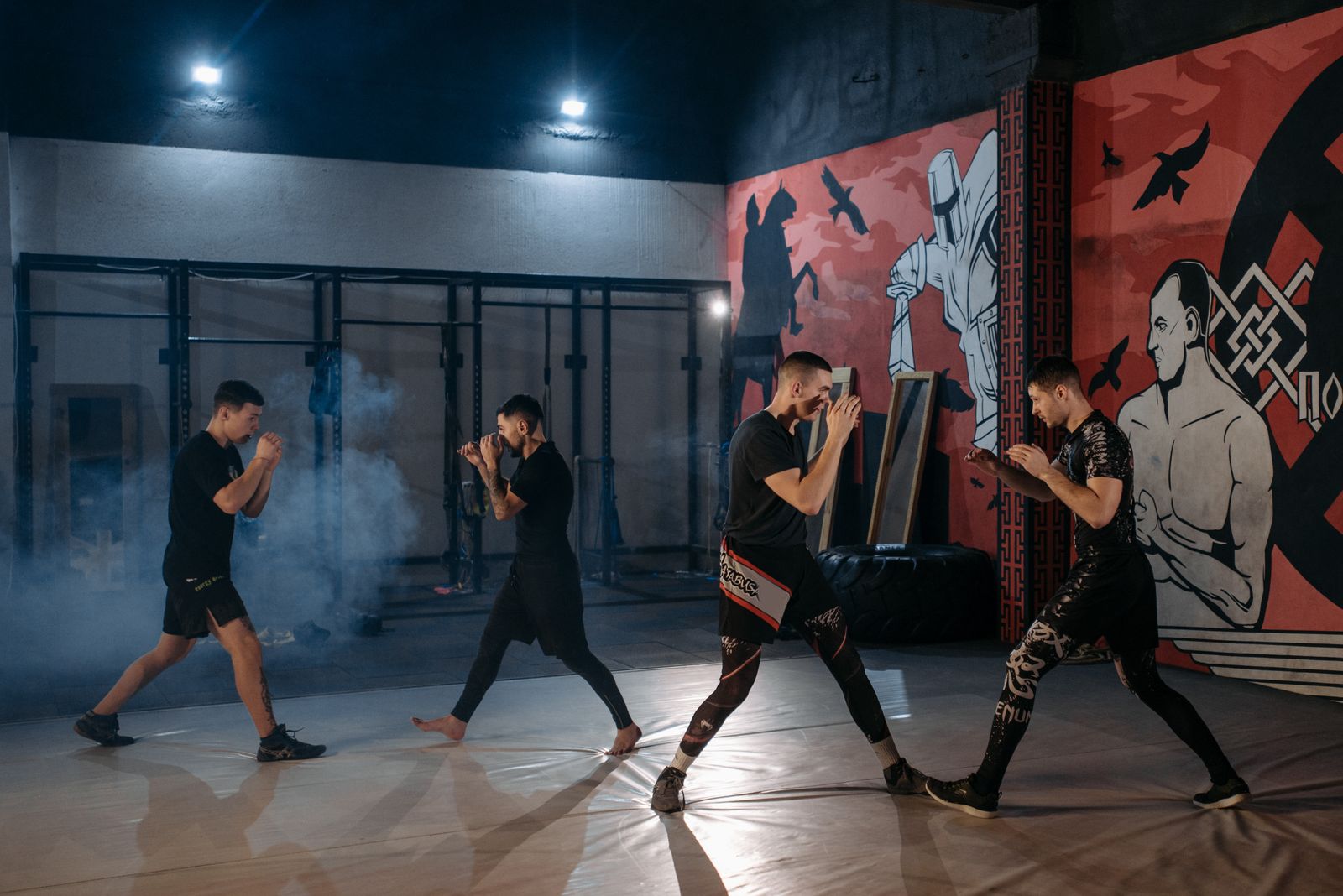 MMA fighters drilling in unison during a striking session