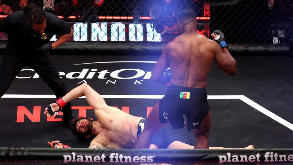 Francis Ngannou stands over a knocked-out Philipe Lins after a first-round KO at MVP MMA 1