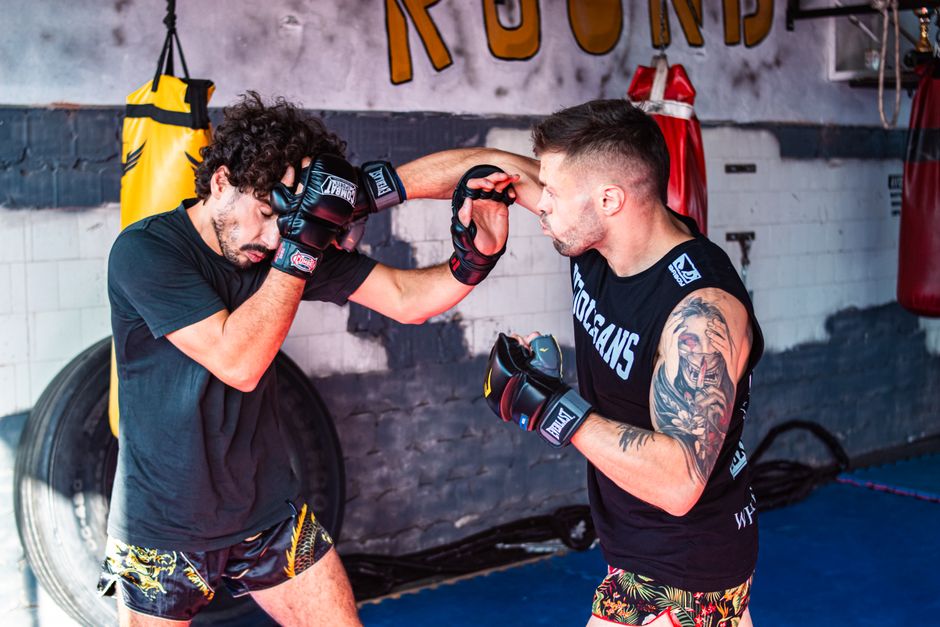MMA fighters sparring — Gaethje-style pressure fighting