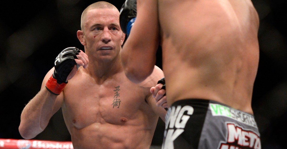 Georges St-Pierre faces off with Johny Hendricks during their controversial split-decision title fight at UFC 167
