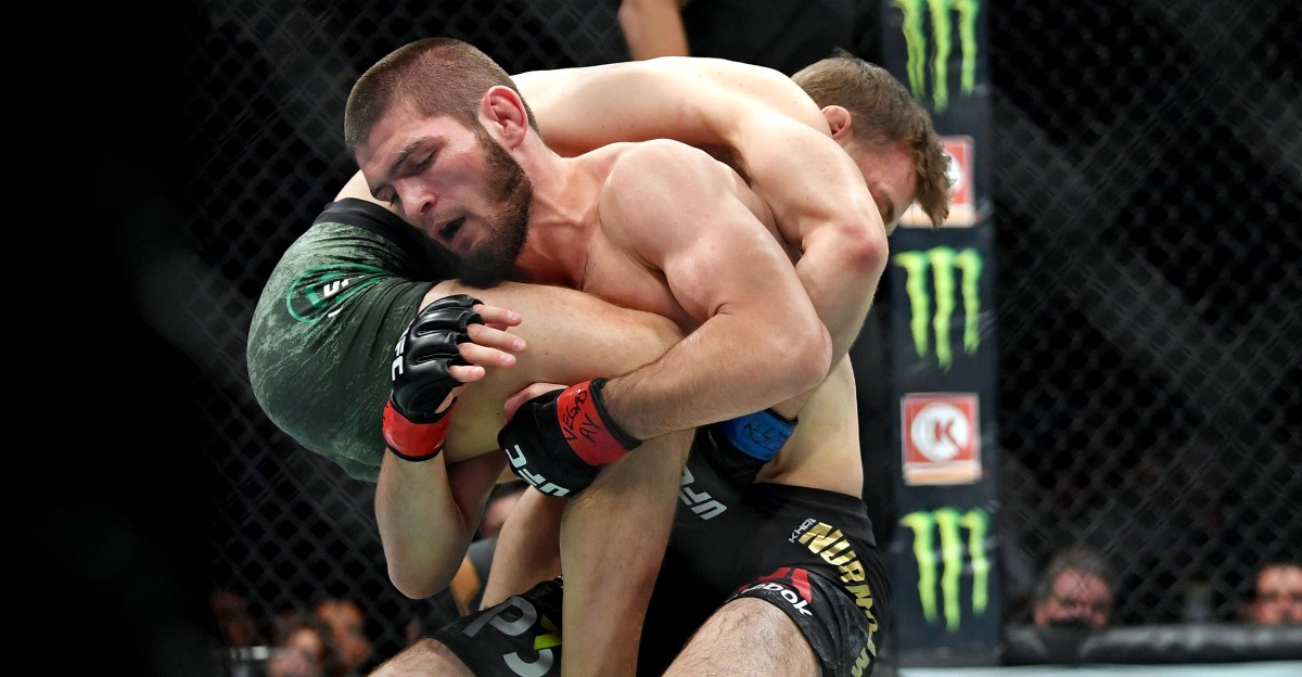 Khabib Nurmagomedov controls Conor McGregor from top position during their UFC 229 fight