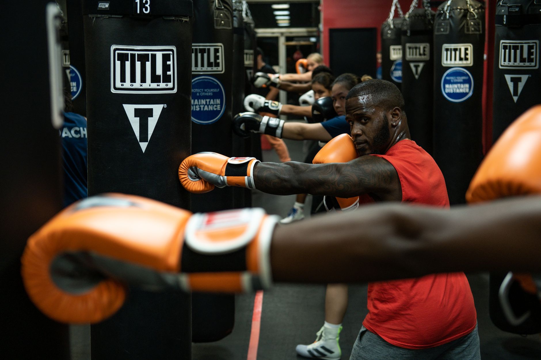 Fighter drilling conditioning work on the heavy bag