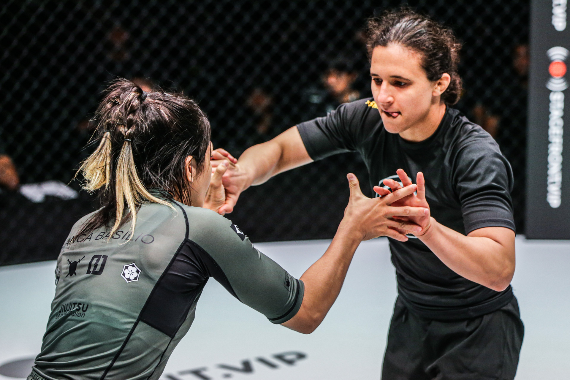Tammi Musumeci and Bianca Basilio grip fighting in properly fitted, compression-tight no-gi rashguards at ONE Championship
