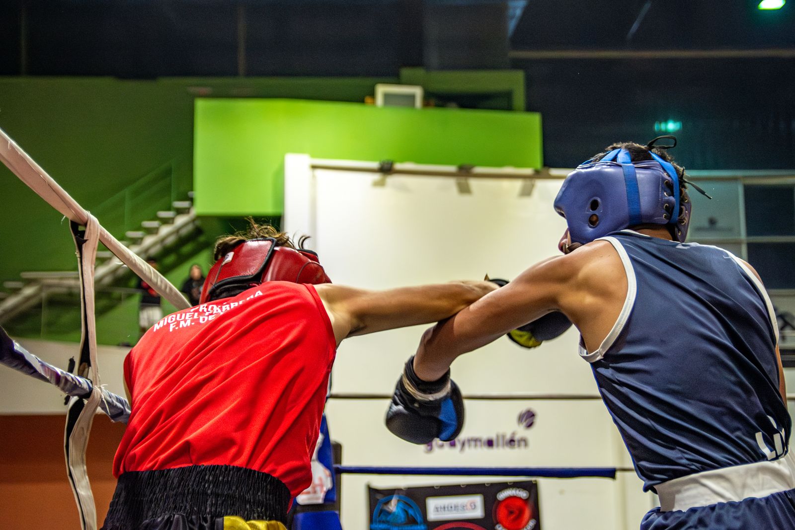 Boxer throwing punch in competition