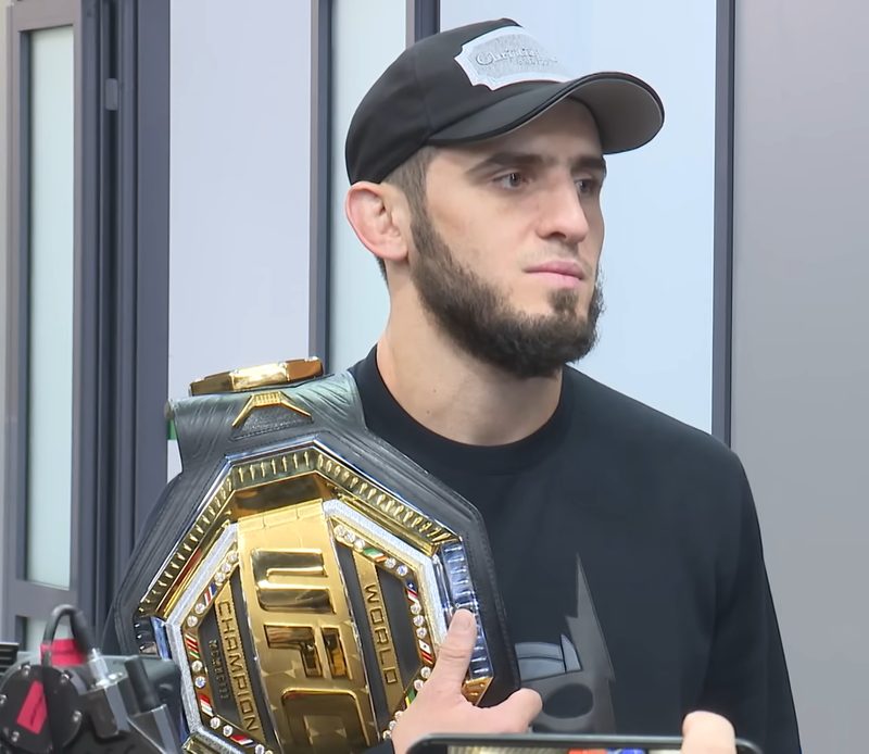 Islam Makhachev holding the UFC lightweight championship belt