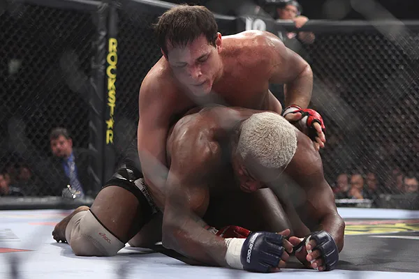 Roger Gracie applying back control on Kevin Randleman before a choke finish