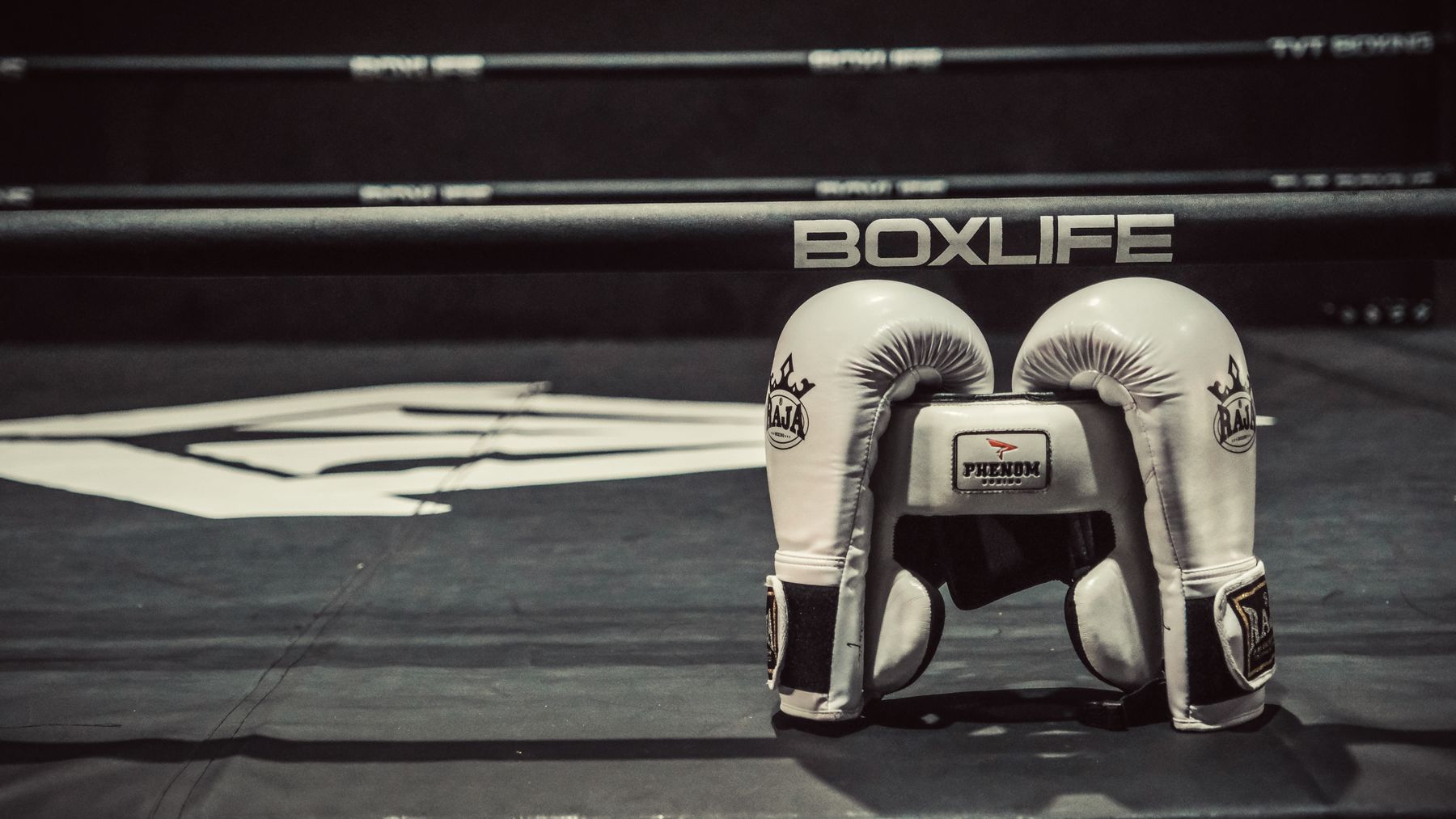 Martial artist grappling exchange showing a takedown attempt