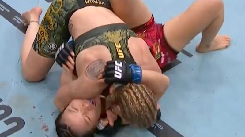 Valentina Shevchenko in ground control position over Zhang Weili during their UFC 322 flyweight title fight