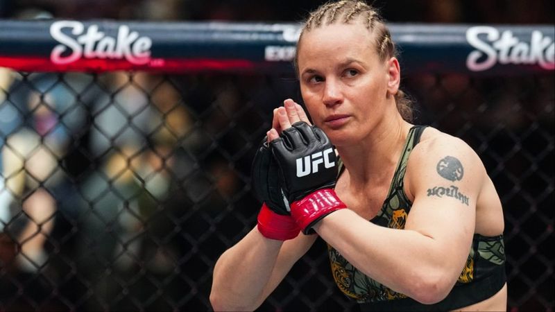 Valentina Shevchenko in the UFC octagon with her Muay Thai tattoo visible on her shoulder