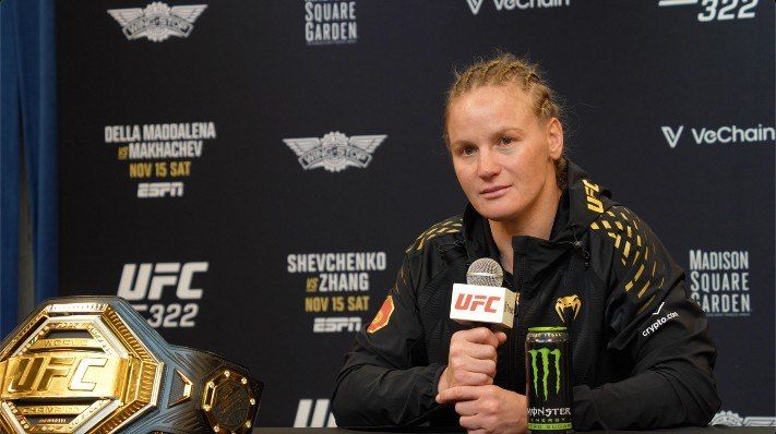 Valentina Shevchenko at the UFC 322 post-fight press conference with her flyweight championship belt