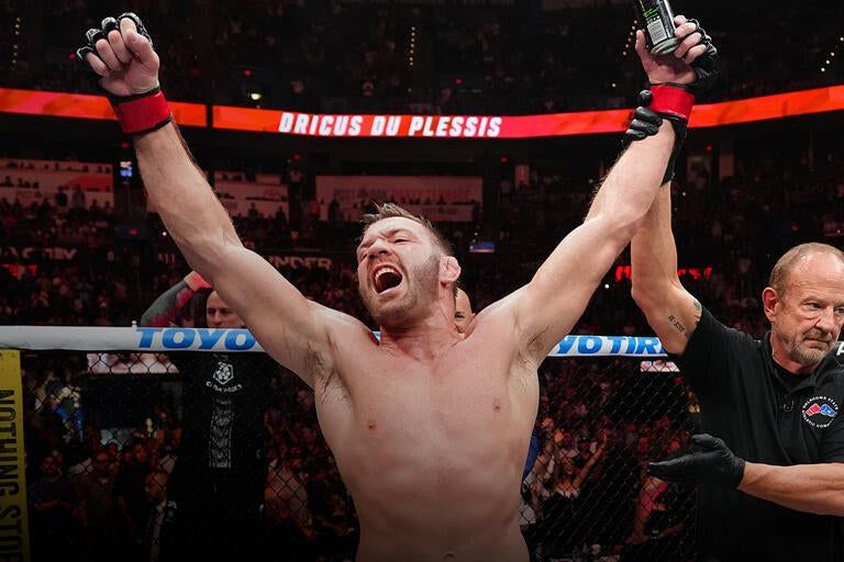 Dricus Du Plessis celebrates after defeating Kamaru Usman in 2026