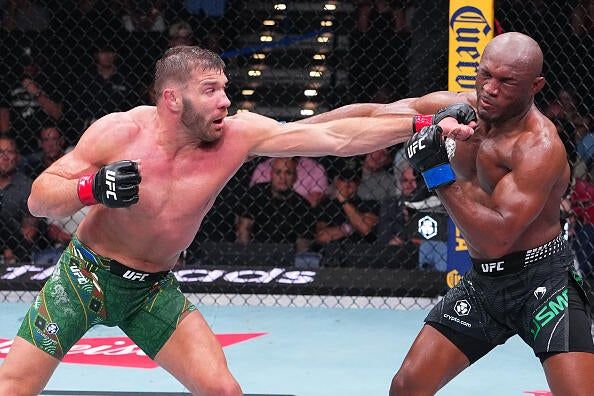 Dricus Du Plessis punches Kamaru Usman during their 2026 middleweight fight