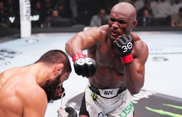 Kamaru Usman fighting style punch during UFC welterweight title defense
