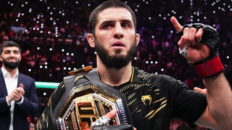 Islam Makhachev holds the UFC belt after a dominant title win