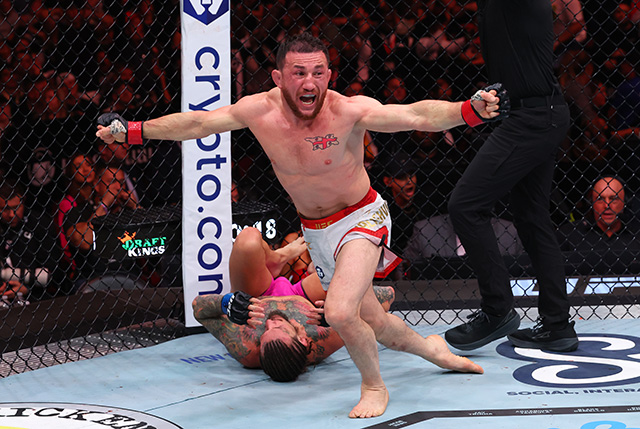 Merab Dvalishvili celebrates a win inside the UFC octagon during his bantamweight title reign