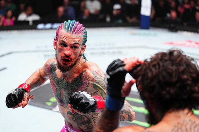 Sean O'Malley exchanges strikes in the UFC octagon as a bantamweight title contender