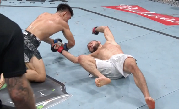 Song Yadong stands over a fallen Umar Nurmagomedov after his UFC Shanghai upset KO